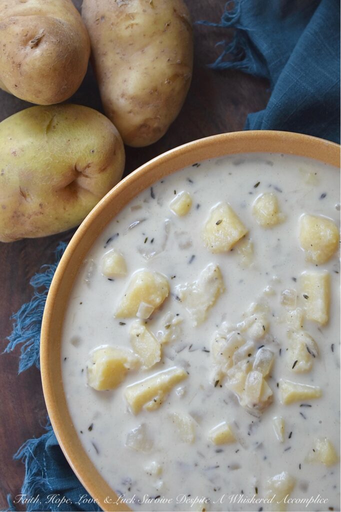 Budget-Friendly Chunky Potato Soup with Thyme - We all love the convenience of a store-bought rotisserie chicken for a quick weeknight dinner, but what if I told you that the best part of the rotisserie chicken is the part that you’ve been throwing away? The next time you buy a rotisserie chicken, instead of tossing out the leftover bones, place them in a large pot, cover them with cold water, and allow them to simmer for about an hour on your stovetop. You'll end up with a homemade broth that's richer and more flavorful than anything you can pour from a carton. And, by using this simple, homemade chicken broth to make this chunky potato soup with thyme, you'll see that you don't need to spend a lot to make amazing food with just a few basic ingredients.