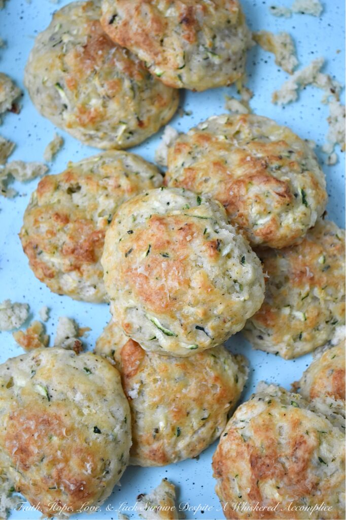 Parmesan Cheese Italian Zucchini Drop Biscuits - Packed with savory Italian seasoning and the irresistible tang of Parmesan cheese, these buttery zucchini biscuits offer a crispy, flaky texture that pairs beautifully with just about anything. You can serve them as a side to your favorite soups or salads, but honestly, they’re just as good for breakfast with a big ol’ pat of butter melting on top. If you’re looking for an easy-to-make biscuit recipe that’s got a little something extra going on, these zucchini drop biscuits are it.