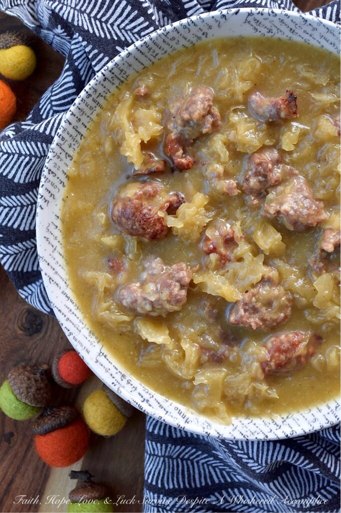Roasted Acorn Squash Oktoberfest Soup - Imagine halved acorn squash, tangy sauerkraut, and savory beer brats, all mingling together in a single baking dish with a generous splash of flavorful Oktoberfest beer and a whisper of brown sugar. Everything roasts to perfection, building layers of irresistible flavor. The oven works its magic, caramelizing, tenderizing, and deepening every single flavor. Then, the roasted squash is whisked into a velvety blend with chicken broth and a kick of hot mustard, before being poured right back into the baking dish with its roasted companions. Baked until thick and bubbly, this isn't just a meal, it's a hearty, warm, German-inspired hug in a bowl.