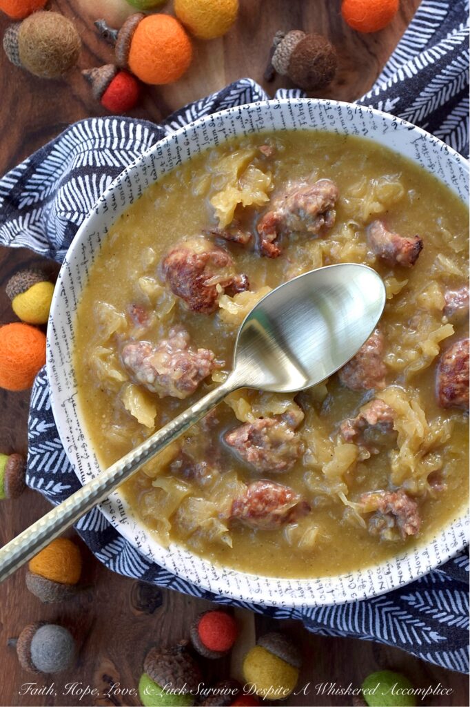 Roasted Acorn Squash Oktoberfest Soup - Imagine halved acorn squash, tangy sauerkraut, and savory beer brats, all mingling together in a single baking dish with a generous splash of flavorful Oktoberfest beer and a whisper of brown sugar. Everything roasts to perfection, building layers of irresistible flavor. The oven works its magic, caramelizing, tenderizing, and deepening every single flavor. Then, the roasted squash is whisked into a velvety blend with chicken broth and a kick of hot mustard, before being poured right back into the baking dish with its roasted companions. Baked until thick and bubbly, this isn't just a meal, it's a hearty, warm, German-inspired hug in a bowl.