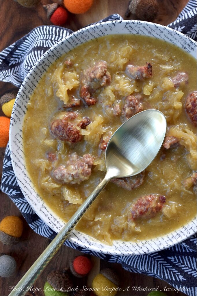 Roasted Acorn Squash Oktoberfest Soup - Imagine halved acorn squash, tangy sauerkraut, and savory beer brats, all mingling together in a single baking dish with a generous splash of flavorful Oktoberfest beer and a whisper of brown sugar. Everything roasts to perfection, building layers of irresistible flavor. The oven works its magic, caramelizing, tenderizing, and deepening every single flavor. Then, the roasted squash is whisked into a velvety blend with chicken broth and a kick of hot mustard, before being poured right back into the baking dish with its roasted companions. Baked until thick and bubbly, this isn't just a meal, it's a hearty, warm, German-inspired hug in a bowl.