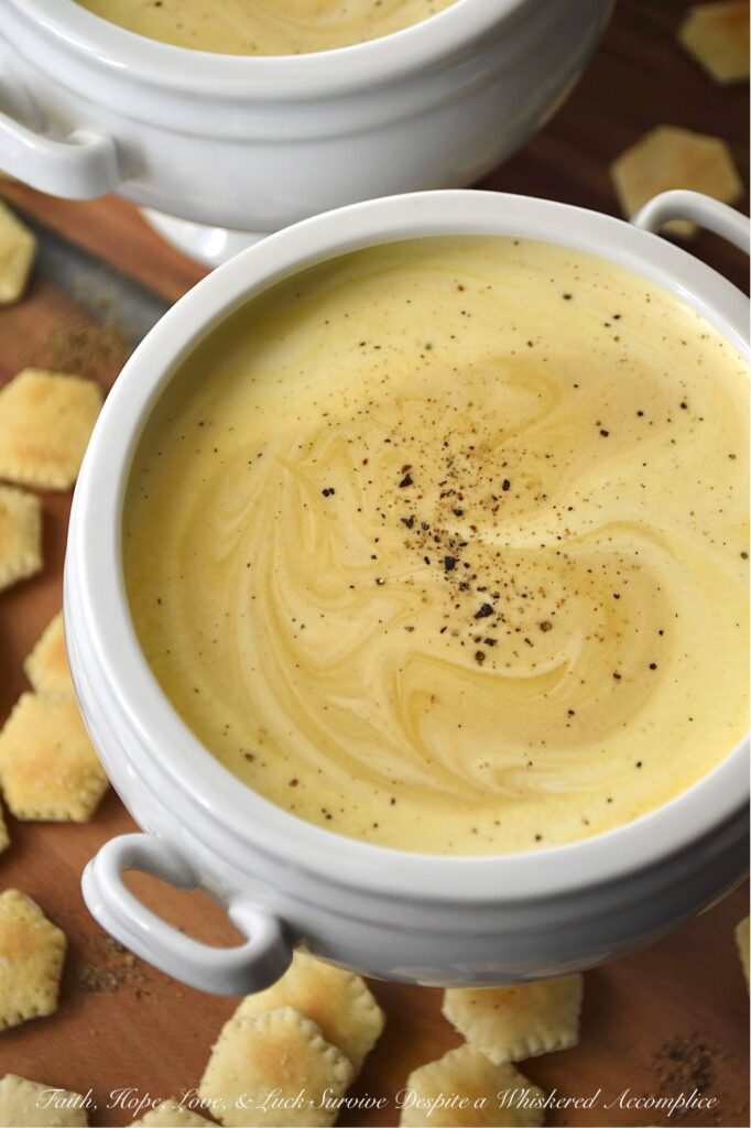 Creamy Butternut Squash Soup with Whiskey - You really don’t need a mile-long list of ingredients to take a classic bowl of creamy puréed butternut squash soup from ho-hum to absolutely swoon-worthy. The secret to unlocking a five-star-worthy butternut squash soup lies in a generous splash of whiskey and a rich swirl of heavy cream. The whiskey lends a subtle, smoky sweetness that makes you wonder why you ever made it any other way, and the cream? Well, it turns the whole thing into a decadent bowl of pure, velvety comfort. After one spoonful, you’ll never look at butternut squash soup the same way again.