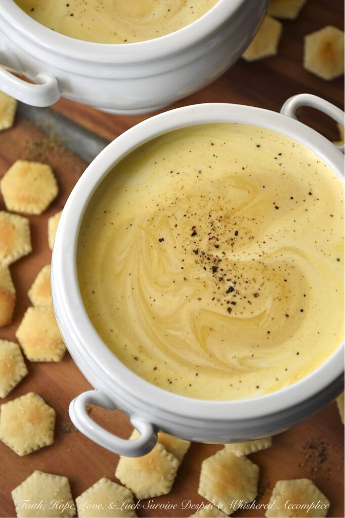 Creamy Butternut Squash Soup with Whiskey - You really don’t need a mile-long list of ingredients to take a classic bowl of creamy puréed butternut squash soup from ho-hum to absolutely swoon-worthy. The secret to unlocking a five-star-worthy butternut squash soup lies in a generous splash of whiskey and a rich swirl of heavy cream. The whiskey lends a subtle, smoky sweetness that makes you wonder why you ever made it any other way, and the cream? Well, it turns the whole thing into a decadent bowl of pure, velvety comfort. After one spoonful, you’ll never look at butternut squash soup the same way again.
