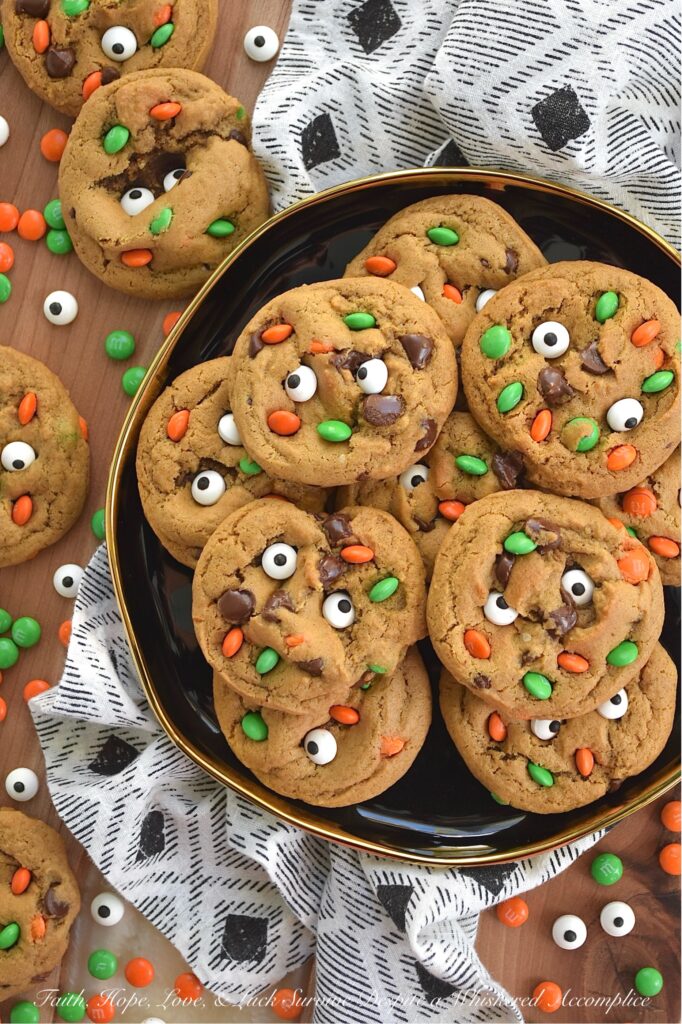 M&M's Minis Halloween Molasses Spice Cookies - These classic, irresistibly chewy molasses spice cookies are getting a delightfully spooky-cute makeover this Halloween season. They’re everything you love about fall. Rich, deeply spiced, and perfectly soft, but with a mischievous, whimsical festive holiday twist. Chocolate chips peeking out from the dough, candy eyeballs staring back at you like they’re up to no good, and a handful of Milk Chocolate M&M’s Minis for a pop of seasonal color and crunch. These cookies are ready to haunt your cookie jar in the best possible way.