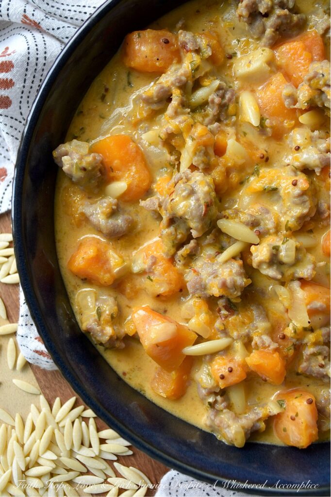 Italian Sausage & Orzo Butternut Squash Soup - There's a special kind of disappointment that comes from finishing a beautiful bowl of soup, only to find your stomach rumbling an hour later. With this flavor-packed, chunky butternut squash soup, we can almost guarantee that your stomach will be satisfied for hours. Sweet Italian sausage and just a bit of orzo pasta transform this seasonal butternut squash soup into a hearty and filling one-pot recipe that's the ultimate answer to "What's for Dinner?" on a cold fall or winter's day. Forget thin broths and simple purées; finished with a generous cup of heavy cream, this rich, flavorful, and unbelievably cozy pot of soup is one you'll come back to all season long.