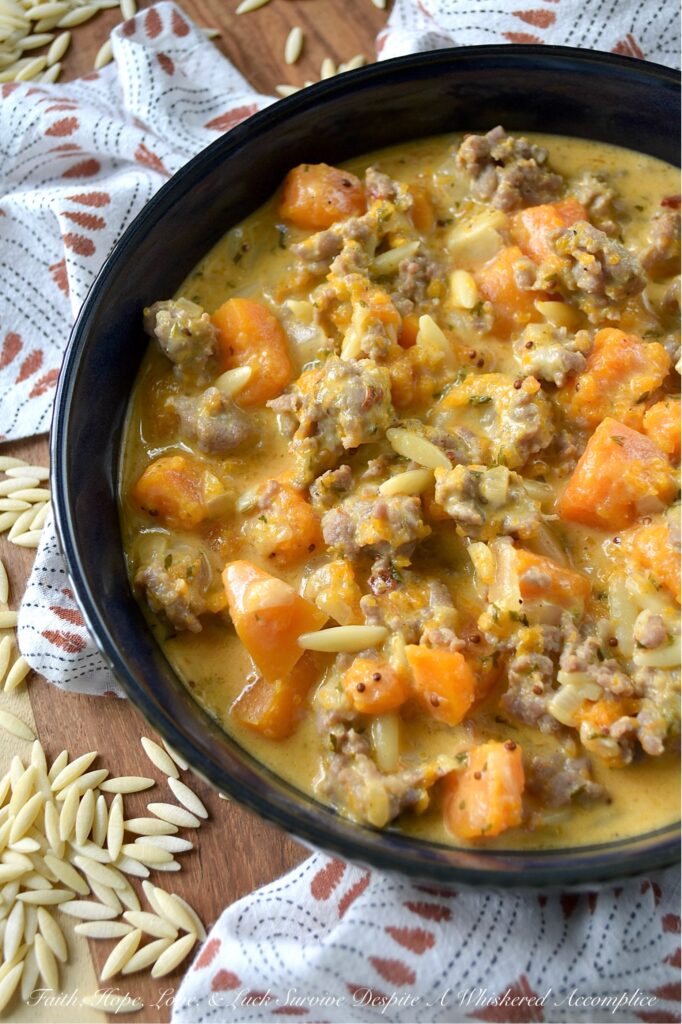 Italian Sausage & Orzo Butternut Squash Soup - There's a special kind of disappointment that comes from finishing a beautiful bowl of soup, only to find your stomach rumbling an hour later. With this flavor-packed, chunky butternut squash soup, we can almost guarantee that your stomach will be satisfied for hours. Sweet Italian sausage and just a bit of orzo pasta transform this seasonal butternut squash soup into a hearty and filling one-pot recipe that's the ultimate answer to "What's for Dinner?" on a cold fall or winter's day. Forget thin broths and simple purées; finished with a generous cup of heavy cream, this rich, flavorful, and unbelievably cozy pot of soup is one you'll come back to all season long.
