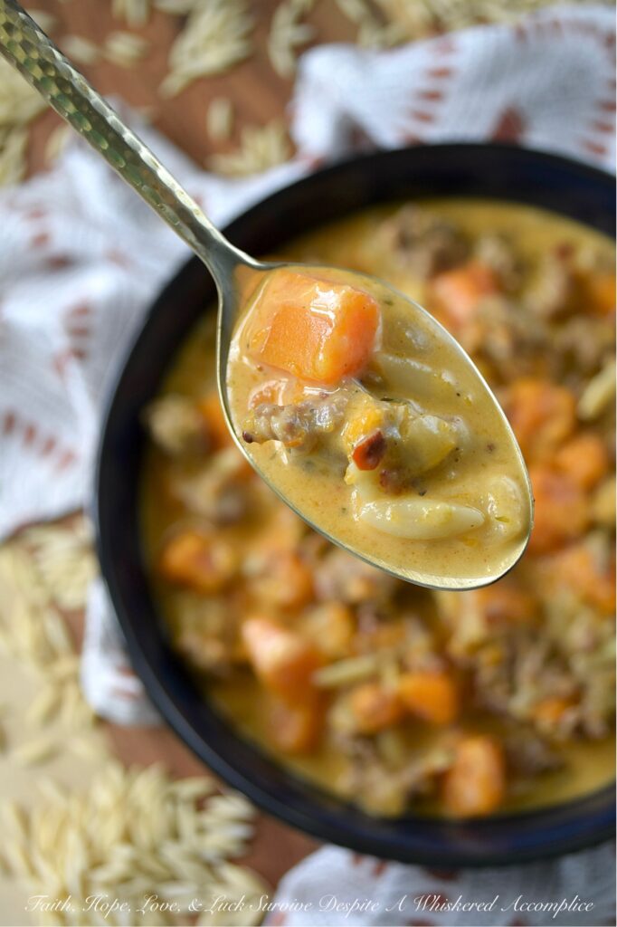 Italian Sausage & Orzo Butternut Squash Soup - There's a special kind of disappointment that comes from finishing a beautiful bowl of soup, only to find your stomach rumbling an hour later. With this flavor-packed, chunky butternut squash soup, we can almost guarantee that your stomach will be satisfied for hours. Sweet Italian sausage and just a bit of orzo pasta transform this seasonal butternut squash soup into a hearty and filling one-pot recipe that's the ultimate answer to "What's for Dinner?" on a cold fall or winter's day. Forget thin broths and simple purées; finished with a generous cup of heavy cream, this rich, flavorful, and unbelievably cozy pot of soup is one you'll come back to all season long.