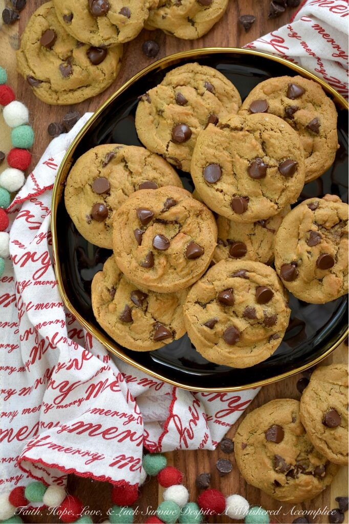 Chocolate Chip Molasses Spice Cookies - What happens when the coziest cookie of the season meets a timeless classic? You get pure, unadulterated magic. Imagine all the warm, chewy, spiced goodness you crave in a molasses spice cookie, but with a generous handful of semi-sweet chocolate chips tossed in for good measure. Think of these Chocolate Chip Molasses Cookies as the more sophisticated, mysterious cousin to the everyday traditional chocolate chip cookie. They're the perfect blend of cozy spice and rich chocolate. A grown-up, more sophisticated chocolate chip cookie that will win you over at first bite.