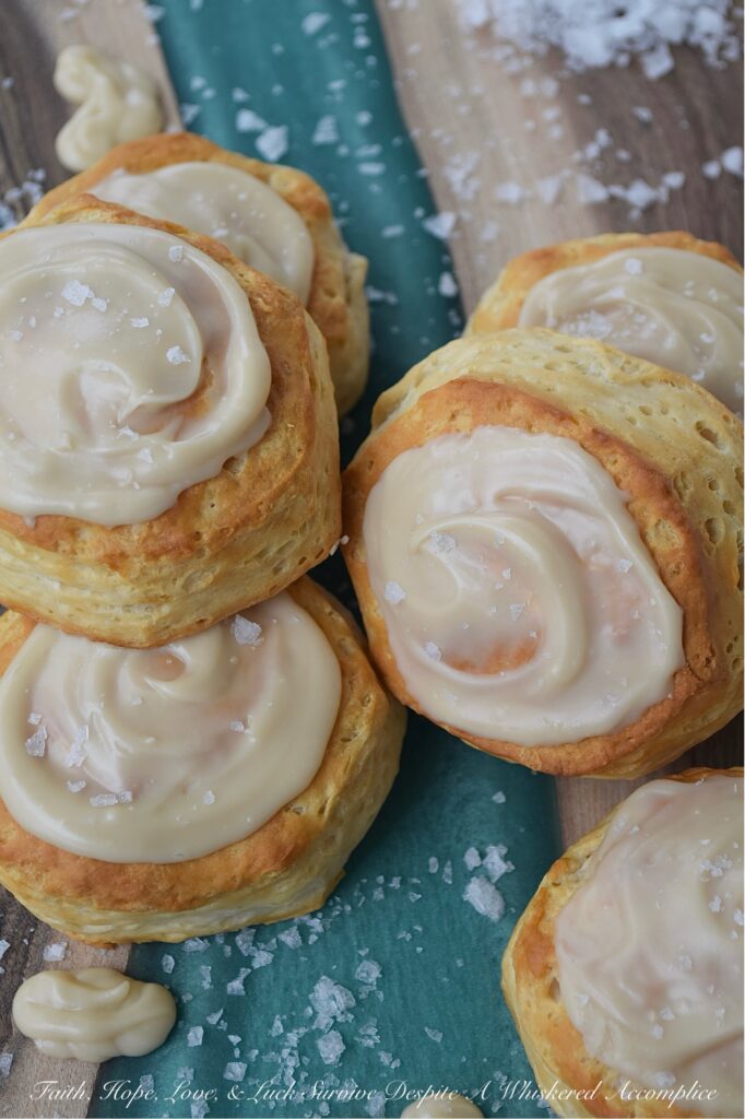 Maple & Buttered Rum Iced Whomp Biscuits - If you're someone who keeps a can or two of trusty refrigerated biscuits, tucked away in your fridge for breakfast emergencies or those nights when breakfast-for-dinner is a common solution to what's for dinner, these Maple & Buttered Rum Iced Whomp Biscuits are a must-try. Traditional whomp biscuits get a serious glow-up, with a swoon-worthy spread of dreamy maple, butter, and rum-flavored icing, followed by a sprinkle of sea salt to balance out the icing's sweet, sticky goodness. After trying these biscuits, you’ll never look at a can of whomp biscuits the same way again.