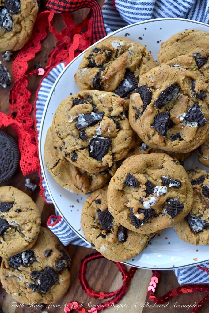 OREO Cookies & Cream Molasses Spice Cookies - What happens when the cozy, nostalgic warmth of your favorite molasses spice cookie meets the iconic, irresistible crunch of an OREO? Pure magic. If you’ve ever found yourself torn between the deep, molasses-rich flavor of a soft and chewy spice cookie and the chocolate-and-cream perfection of an OREO cookie, then prepare to have your mind blown. This cookie mashup brings the two legendary cookies together to create one spectacular recipe. These OREO Cookies & Cream Molasses Spice Cookies are packed with warm notes of ginger, cinnamon, nutmeg, and cloves, but with a rebellious, delightful twist. A generous helping of crushed OREO cookie pieces adds a lovely crunch you're bound to fall head over heels for at first bite. This is, without a doubt, a match made in cookie heaven.