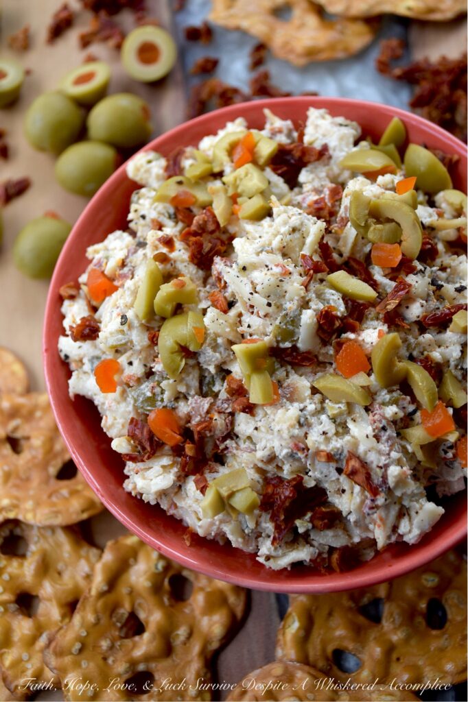 Italian Mozzarella & Green Olive Cheese Spread - If you’re looking for a cheese spread that’s ready to party, this Italian-inspired mozzarella cheese spread is it. Loaded with salty pimento-stuffed green olives, sweet sun-dried tomatoes, and a good sprinkle of Italian herbs, this is the kind of cheesy goodness that’s just as happy piled onto pretzels, crackers, or pita crisps as it is tucked inside a mini sandwich. And, with its cheery pop of red and green, this appetizer is basically waving its arms and shouting, "Pick me!" for your holiday snack table.