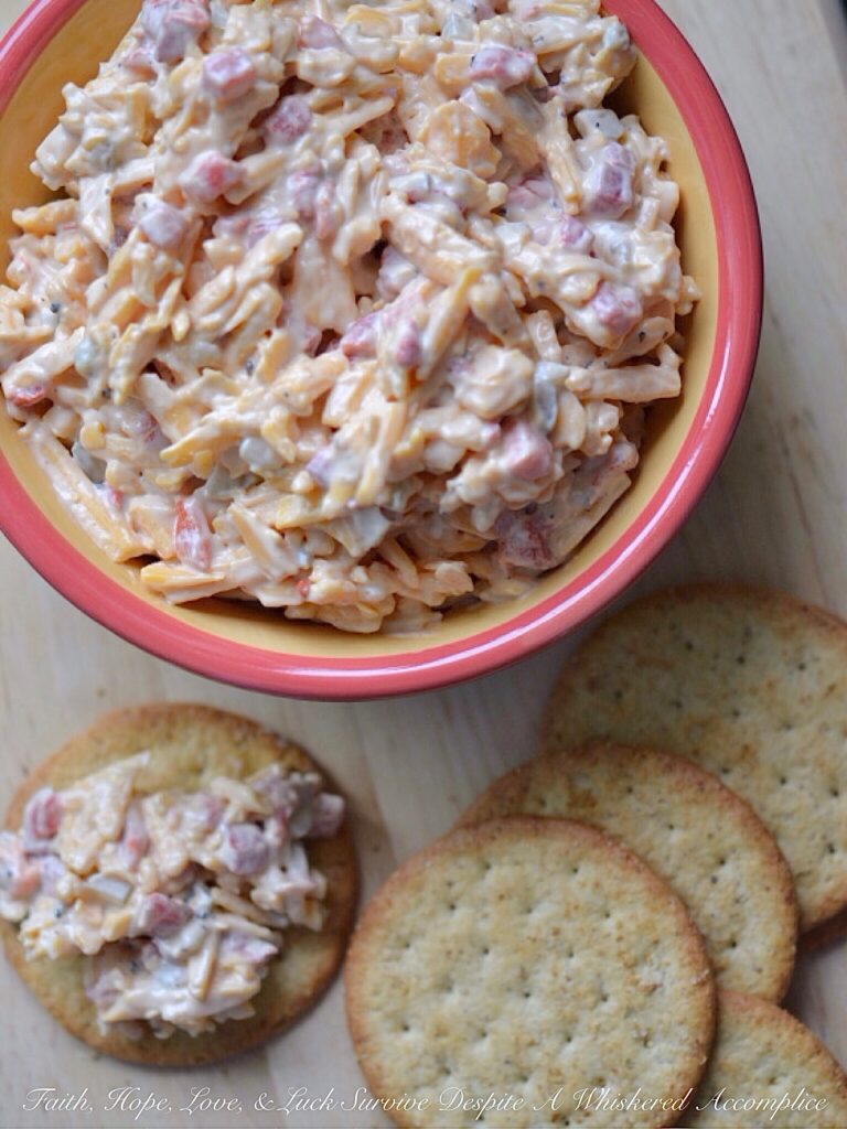 6-Ingredient Pimento Cheese Spread - It only takes 6 ingredients to make an amazingly delicious homemade pimento cheese spread, perfect for a last-minute party or snack appetizer. Add a little bit of black pepper, dill pickle, and Worcestershire sauce to some grated cheddar cheese, mayonnaise, and diced pimentos for a cheesy snack you simply won't be able to stop eating.