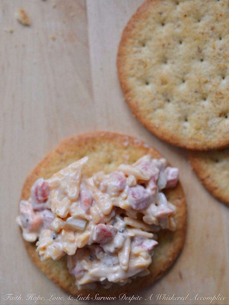 6-Ingredient Pimento Cheese Spread - It only takes 6 ingredients to make an amazingly delicious homemade pimento cheese spread, perfect for a last-minute party or snack appetizer. Add a little bit of black pepper, dill pickle, and Worcestershire sauce to some grated cheddar cheese, mayonnaise, and diced pimentos for a cheesy snack you simply won't be able to stop eating.