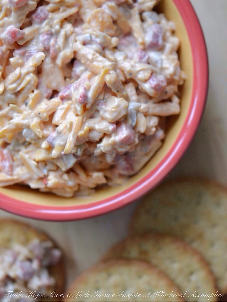 6-Ingredient Pimento Cheese Spread - It only takes 6 ingredients to make an amazingly delicious homemade pimento cheese spread, perfect for a last-minute party or snack appetizer. Add a little bit of black pepper, dill pickle, and Worcestershire sauce to some grated cheddar cheese, mayonnaise, and diced pimentos for a cheesy snack you simply won't be able to stop eating.