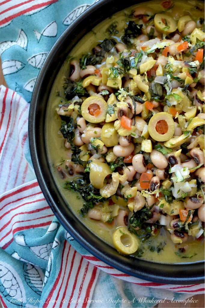 Black-Eyed Pea & Basil Green Olive Salad - Let's be honest. Black-eyed peas by themselves are pretty plain and don’t have much flavor, despite their reputation for bringing good luck. But when you mix them with chopped pimento-stuffed green olives, plenty of fresh basil, and a tangy lemon, mustard, and honey dressing, they become something truly special. This black-eyed pea salad is just begging to be the star at your next party, gathering, or New Year’s Day celebration. Whether you pile it high on triangle-sliced pita, scoop it up with crunchy tortilla chips, or simply eat it straight from the bowl as a side dish, this green olive salad is sure to be a hit.