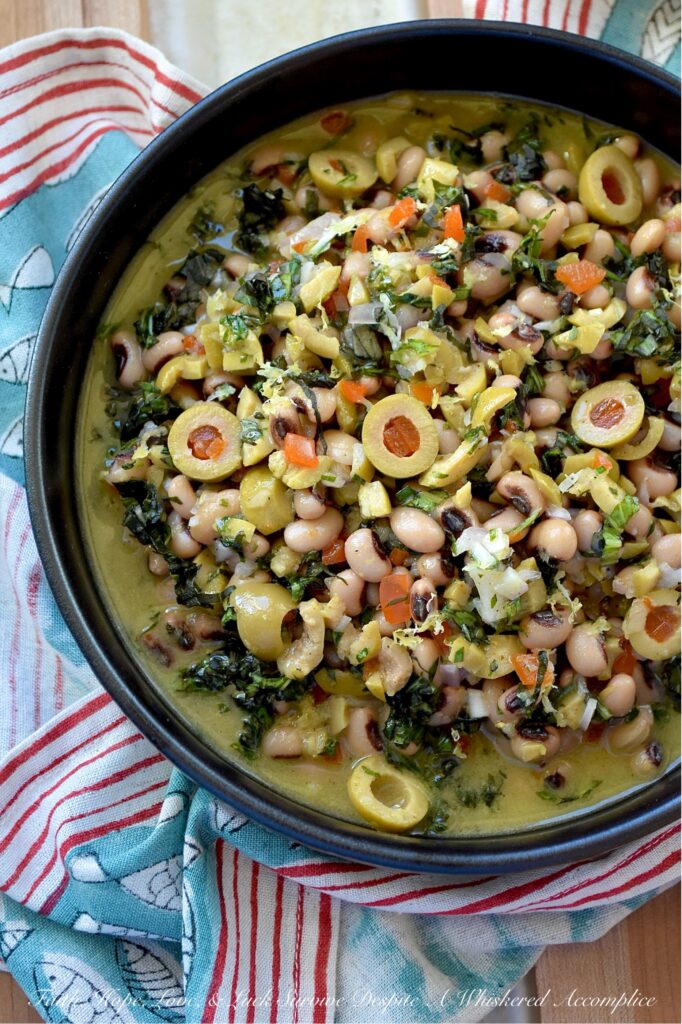 Black-Eyed Pea & Basil Green Olive Salad - Let's be honest. Black-eyed peas by themselves are pretty plain and don’t have much flavor, despite their reputation for bringing good luck. But when you mix them with chopped pimento-stuffed green olives, plenty of fresh basil, and a tangy lemon, mustard, and honey dressing, they become something truly special. This black-eyed pea salad is just begging to be the star at your next party, gathering, or New Year’s Day celebration. Whether you pile it high on triangle-sliced pita, scoop it up with crunchy tortilla chips, or simply eat it straight from the bowl as a side dish, this green olive salad is sure to be a hit.