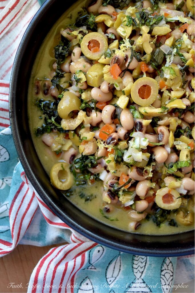 Black-Eyed Pea & Basil Green Olive Salad - Let's be honest. Black-eyed peas by themselves are pretty plain and don’t have much flavor, despite their reputation for bringing good luck. But when you mix them with chopped pimento-stuffed green olives, plenty of fresh basil, and a tangy lemon, mustard, and honey dressing, they become something truly special. This black-eyed pea salad is just begging to be the star at your next party, gathering, or New Year’s Day celebration. Whether you pile it high on triangle-sliced pita, scoop it up with crunchy tortilla chips, or simply eat it straight from the bowl as a side dish, this green olive salad is sure to be a hit.