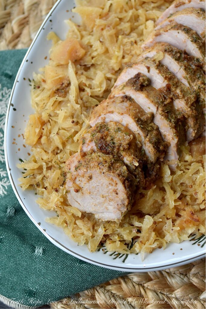 Baked Pork Tenderloins & Dried Apple Sauerkraut - This cozy, stick-to-your-ribs dinner practically makes itself. The pork tenderloins are nestled atop a flavorful bed of sweet and tangy sauerkraut, with little pops of finely chopped dried apples tucked in for good measure. After being baked to golden perfection, the tenderloins come out juicy and packed with flavor. And since everything is baked together in one large casserole dish, you can spend less time washing dishes and more time plotting how to snag that last piece of pork before anyone else does.