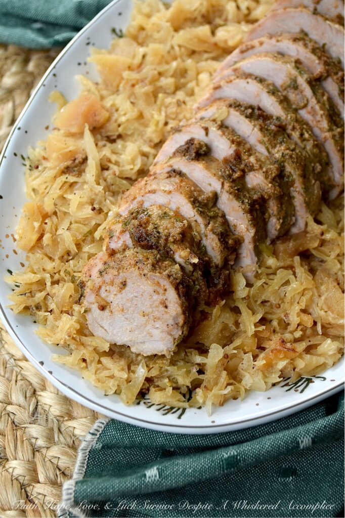 Baked Pork Tenderloins & Dried Apple Sauerkraut - This cozy, stick-to-your-ribs dinner practically makes itself. The pork tenderloins are nestled atop a flavorful bed of sweet and tangy sauerkraut, with little pops of finely chopped dried apples tucked in for good measure. After being baked to golden perfection, the tenderloins come out juicy and packed with flavor. And since everything is baked together in one large casserole dish, you can spend less time washing dishes and more time plotting how to snag that last piece of pork before anyone else does.