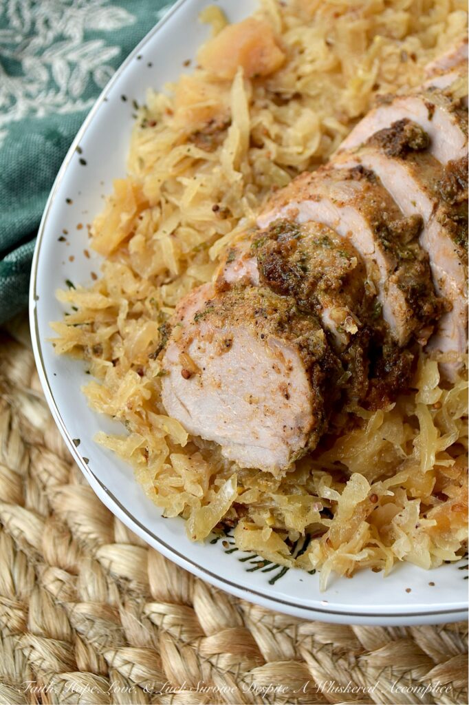 Baked Pork Tenderloins & Dried Apple Sauerkraut - This cozy, stick-to-your-ribs dinner practically makes itself. The pork tenderloins are nestled atop a flavorful bed of sweet and tangy sauerkraut, with little pops of finely chopped dried apples tucked in for good measure. After being baked to golden perfection, the tenderloins come out juicy and packed with flavor. And since everything is baked together in one large casserole dish, you can spend less time washing dishes and more time plotting how to snag that last piece of pork before anyone else does.