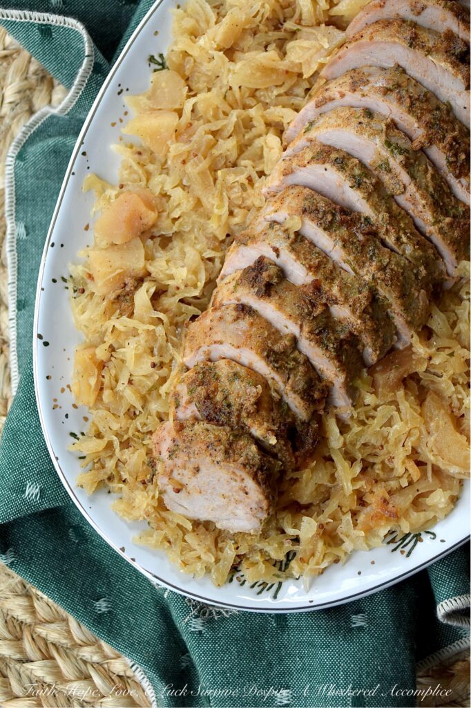 Baked Pork Tenderloins & Dried Apple Sauerkraut - This cozy, stick-to-your-ribs dinner practically makes itself. The pork tenderloins are nestled atop a flavorful bed of sweet and tangy sauerkraut, with little pops of finely chopped dried apples tucked in for good measure. After being baked to golden perfection, the tenderloins come out juicy and packed with flavor. And since everything is baked together in one large casserole dish, you can spend less time washing dishes and more time plotting how to snag that last piece of pork before anyone else does.