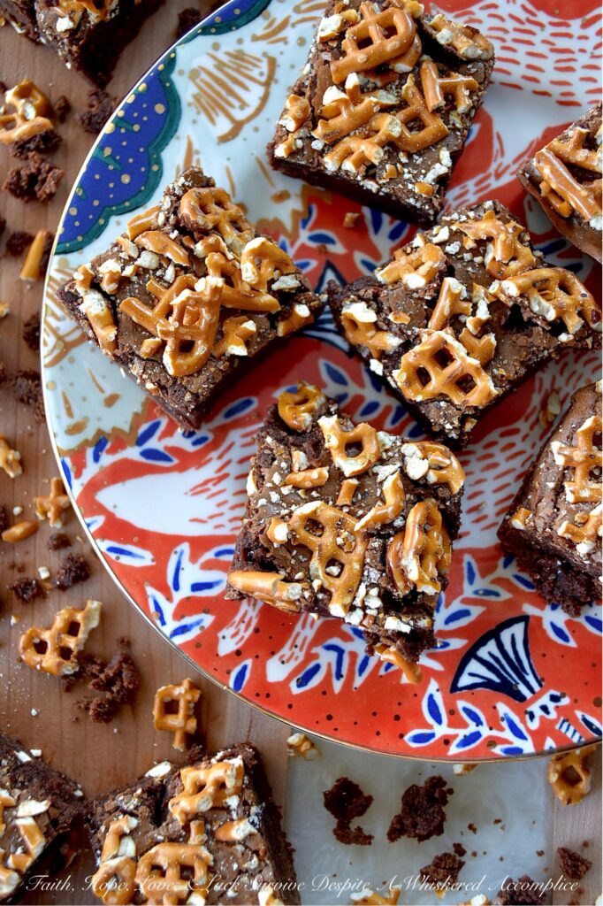 Dark Chocolate Crushed Pretzel-Topped Brownies - These lil' beauties manage to be both fudgy and cakey all at once, with a salty, crunchy bite from the crushed pretzel topping that keeps things both interesting and flavorful. They’re not too sweet either, which means you can actually taste the deep, rich chocolate flavor from both the dark chocolate candy bar and unsweetened cocoa powder they are made with. If you’re a brownie lover who also has a soft spot for pretzels, you absolutely need to bake a batch of these dark chocolate crushed pretzel-topped brownies.