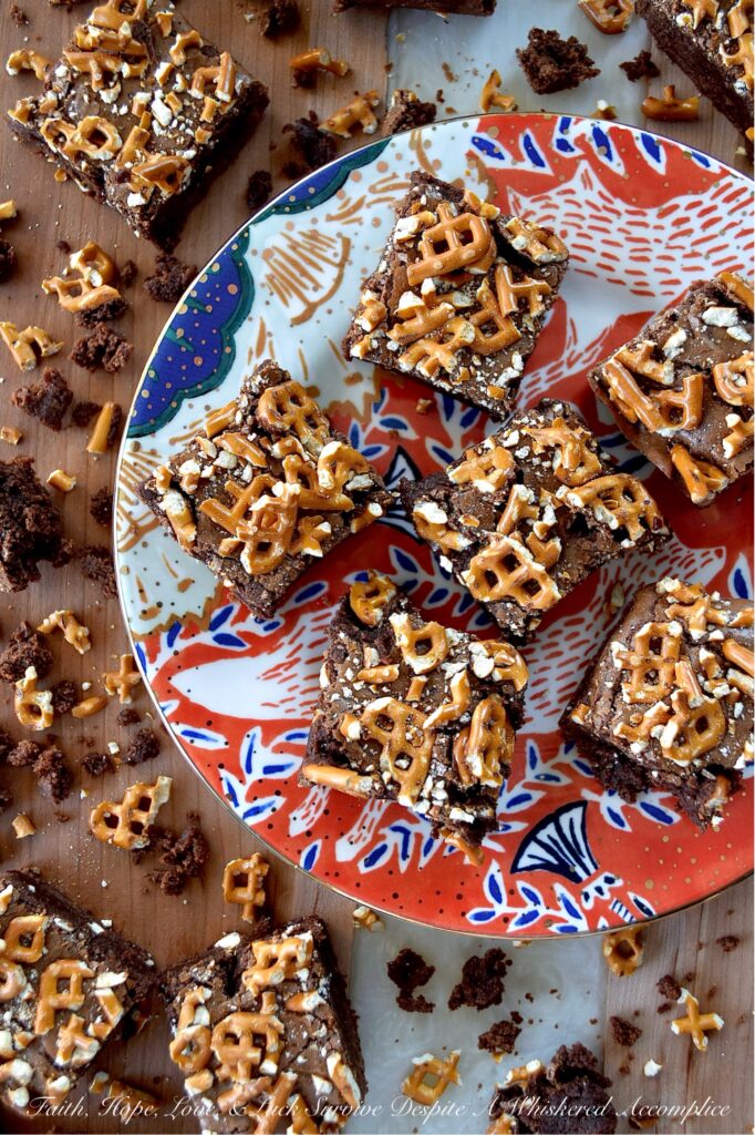 Dark Chocolate Crushed Pretzel-Topped Brownies - These lil' beauties manage to be both fudgy and cakey all at once, with a salty, crunchy bite from the crushed pretzel topping that keeps things both interesting and flavorful. They’re not too sweet either, which means you can actually taste the deep, rich chocolate flavor from both the dark chocolate candy bar and unsweetened cocoa powder they are made with. If you’re a brownie lover who also has a soft spot for pretzels, you absolutely need to bake a batch of these dark chocolate crushed pretzel-topped brownies.