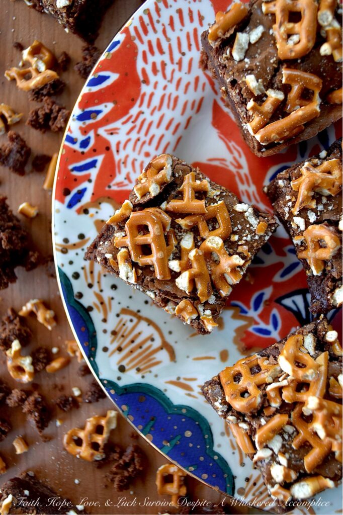 Dark Chocolate Crushed Pretzel-Topped Brownies - These lil' beauties manage to be both fudgy and cakey all at once, with a salty, crunchy bite from the crushed pretzel topping that keeps things both interesting and flavorful. They’re not too sweet either, which means you can actually taste the deep, rich chocolate flavor from both the dark chocolate candy bar and unsweetened cocoa powder they are made with. If you’re a brownie lover who also has a soft spot for pretzels, you absolutely need to bake a batch of these dark chocolate crushed pretzel-topped brownies.