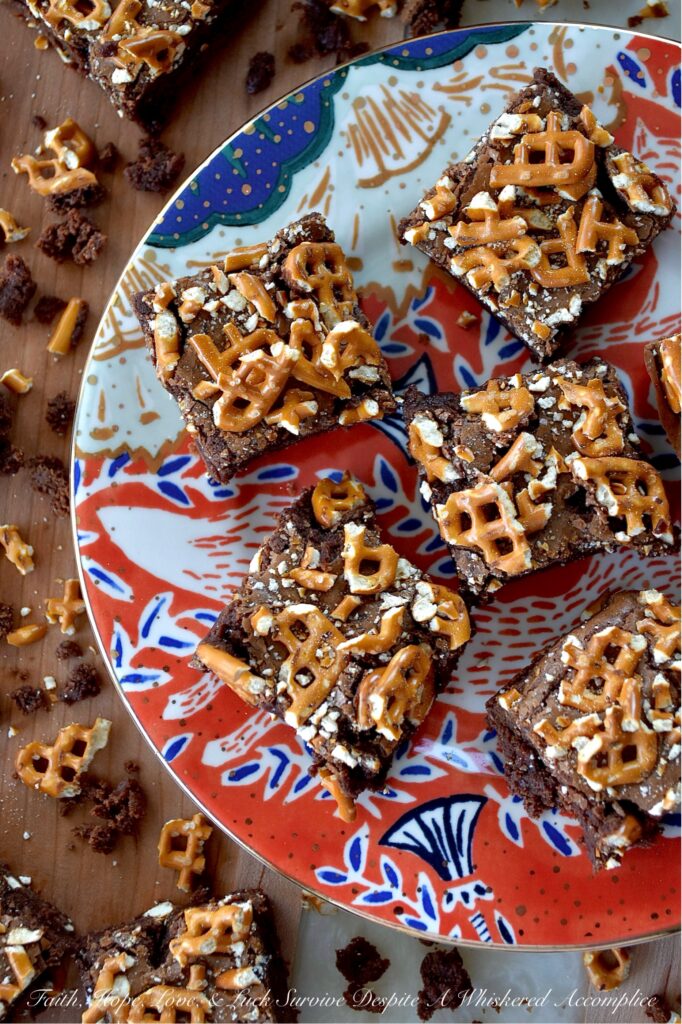 Dark Chocolate Crushed Pretzel-Topped Brownies - These lil' beauties manage to be both fudgy and cakey all at once, with a salty, crunchy bite from the crushed pretzel topping that keeps things both interesting and flavorful. They’re not too sweet either, which means you can actually taste the deep, rich chocolate flavor from both the dark chocolate candy bar and unsweetened cocoa powder they are made with. If you’re a brownie lover who also has a soft spot for pretzels, you absolutely need to bake a batch of these dark chocolate crushed pretzel-topped brownies.