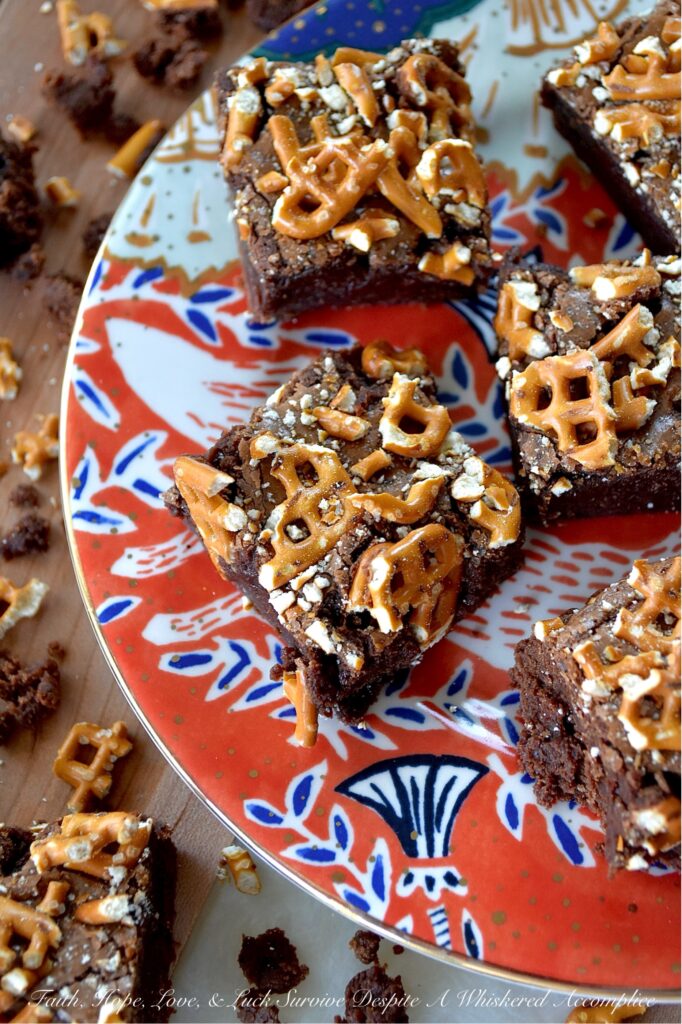 Dark Chocolate Crushed Pretzel-Topped Brownies - These lil' beauties manage to be both fudgy and cakey all at once, with a salty, crunchy bite from the crushed pretzel topping that keeps things both interesting and flavorful. They’re not too sweet either, which means you can actually taste the deep, rich chocolate flavor from both the dark chocolate candy bar and unsweetened cocoa powder they are made with. If you’re a brownie lover who also has a soft spot for pretzels, you absolutely need to bake a batch of these dark chocolate crushed pretzel-topped brownies.