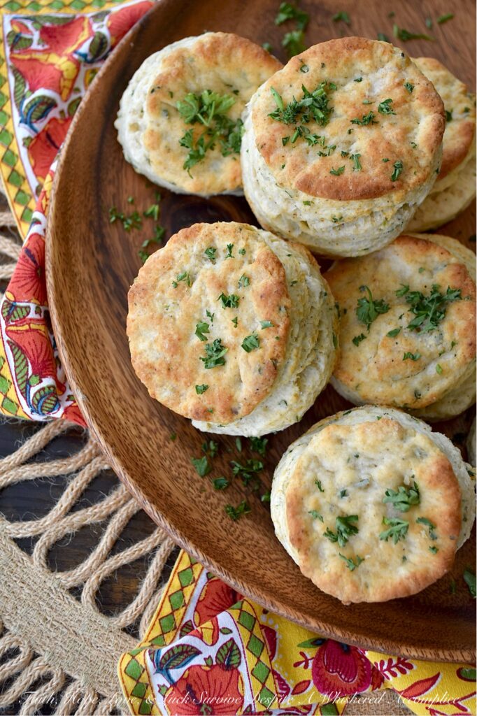 Savory Fresh Parsley Layered Biscuits - Y’all, I’m not saying you need to eat these savory layered biscuits straight from the oven, but I highly recommend it. With their layers upon layers of buttery, flaky goodness and their savory burst of garlic powder, onion powder, and fresh parsley, these biscuits are about to become your absolute fave. And, if you’re feeling a wee bit indulgent, why not go ahead and drizzle a bit of honey over the top of them for a sweet and savory treat? Whether served with bacon and eggs, alongside a warm bowl of soup, or simply spread with a bit of fruity jam or preserves, these biscuits are about to become your newest obsession. Don't say I didn't warn you.