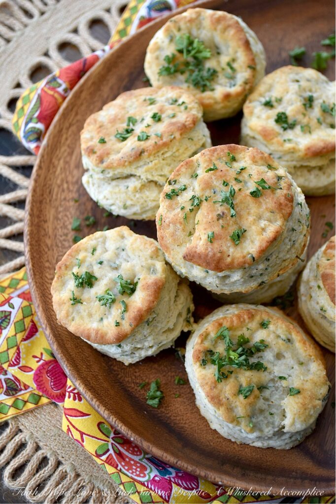 Savory Fresh Parsley Layered Biscuits - Y’all, I’m not saying you need to eat these savory layered biscuits straight from the oven, but I highly recommend it. With their layers upon layers of buttery, flaky goodness and their savory burst of garlic powder, onion powder, and fresh parsley, these biscuits are about to become your absolute fave. And, if you’re feeling a wee bit indulgent, why not go ahead and drizzle a bit of honey over the top of them for a sweet and savory treat? Whether served with bacon and eggs, alongside a warm bowl of soup, or simply spread with a bit of fruity jam or preserves, these biscuits are about to become your newest obsession. Don't say I didn't warn you.