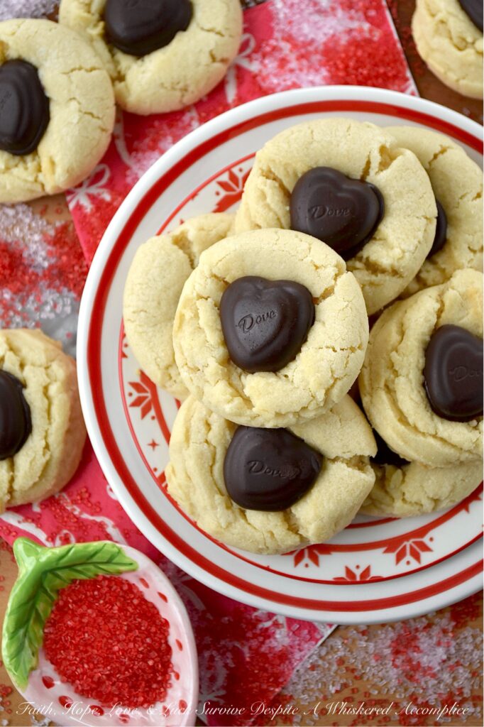 Heart-Melting Simple Vanilla Sugar Cookies - These simple Valentine's Day sugar cookies, decorated with heart-shaped chocolates, are flaky, golden, and delicately crumbly. Buttery, vanilla-flavored, and balanced with a wee hint of salt to make every flavor pop, they're the perfect sweet treat to surprise a loved one or to treat yourself. They're sure to melt your heart with every sweet, sugary, chocolatey bite.