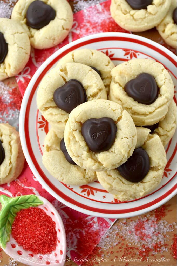 Heart-Melting Simple Vanilla Sugar Cookies - These simple Valentine's Day sugar cookies, decorated with heart-shaped chocolates, are flaky, golden, and delicately crumbly. Buttery, vanilla-flavored, and balanced with a wee hint of salt to make every flavor pop, they're the perfect sweet treat to surprise a loved one or to treat yourself. They're sure to melt your heart with every sweet, sugary, chocolatey bite.