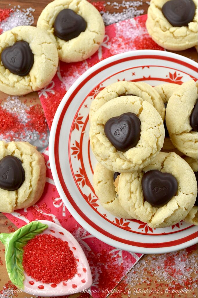 Heart-Melting Simple Vanilla Sugar Cookies - These simple Valentine's Day sugar cookies, decorated with heart-shaped chocolates, are flaky, golden, and delicately crumbly. Buttery, vanilla-flavored, and balanced with a wee hint of salt to make every flavor pop, they're the perfect sweet treat to surprise a loved one or to treat yourself. They're sure to melt your heart with every sweet, sugary, chocolatey bite.