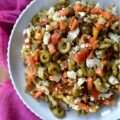 Mild Green Olive Salad Muffuletta Spread - Of course, this green olive salad is the classic go-to for muffuletta sandwiches, but it’s just as irresistible piled onto a hot, cheesy pizza, creamy deviled eggs, or simply scooped up or spread on a hunk of crusty bread. With buttery-soft green, ripe, pitted olives, mild giardiniera, and capers all mingling together in a simple red wine vinaigrette, you get a burst of flavor that’s big on taste but not on heat. Basically, this is the kind of condiment you’ll want to slather on just about every sandwich you make from here on out.