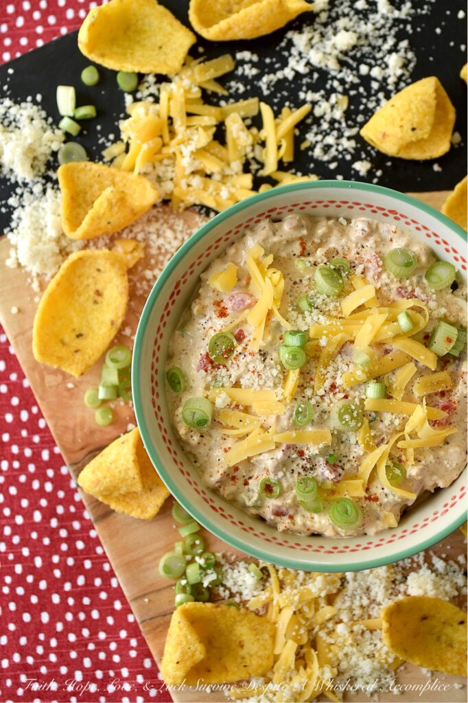 Parmesan & Cheddar Pimento Corn Chip Dip - If you're a wimp when it comes to spicy food, this flavorful Parmesan and Cheddar corn chip dip is for you. It's creamy, cheesy, absolutely packed with diced pimento, and full of flavor, without the heat found in most traditional corn chip dips. Paired with crunchy corn chips, it's the ultimate party starter, game day snack, or stay-at-home movie-night treat. And, if you’re the type of person who likes to live dangerously and crank up the heat, go right on ahead and fold in a finely chopped jalapeño. Don't be afraid to play around with the ingredients in this recipe and make it your own.
