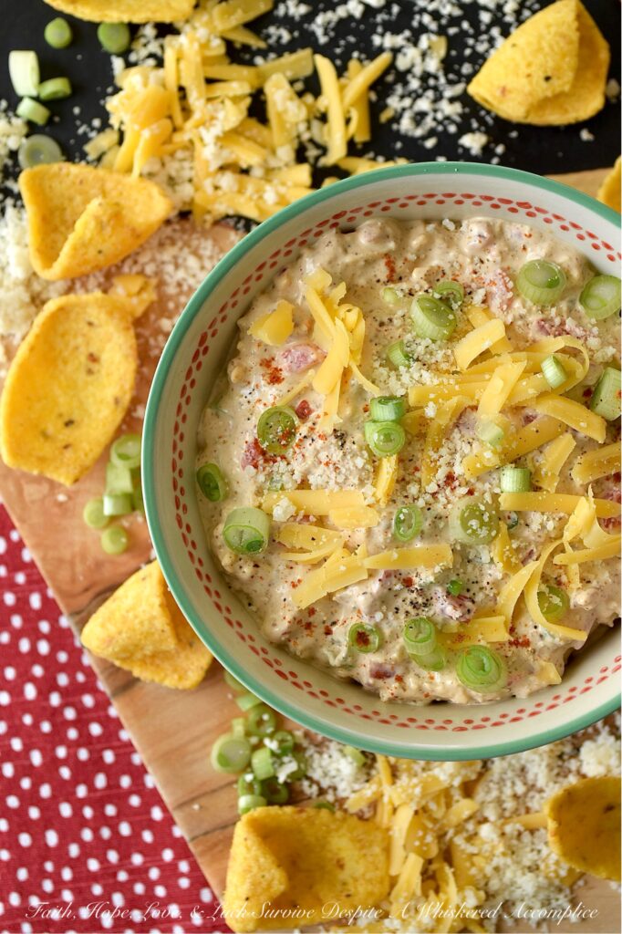 Parmesan & Cheddar Pimento Corn Chip Dip - If you're a wimp when it comes to spicy food, this flavorful Parmesan and Cheddar corn chip dip is for you. It's creamy, cheesy, absolutely packed with diced pimento, and full of flavor, without the heat found in most traditional corn chip dips. Paired with crunchy corn chips, it's the ultimate party starter, game day snack, or stay-at-home movie-night treat. And, if you’re the type of person who likes to live dangerously and crank up the heat, go right on ahead and fold in a finely chopped jalapeño. Don't be afraid to play around with the ingredients in this recipe and make it your own.
