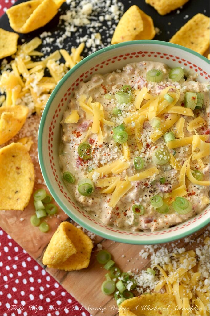 Parmesan & Cheddar Pimento Corn Chip Dip - If you're a wimp when it comes to spicy food, this flavorful Parmesan and Cheddar corn chip dip is for you. It's creamy, cheesy, absolutely packed with diced pimento, and full of flavor, without the heat found in most traditional corn chip dips. Paired with crunchy corn chips, it's the ultimate party starter, game day snack, or stay-at-home movie-night treat. And, if you’re the type of person who likes to live dangerously and crank up the heat, go right on ahead and fold in a finely chopped jalapeño. Don't be afraid to play around with the ingredients in this recipe and make it your own.