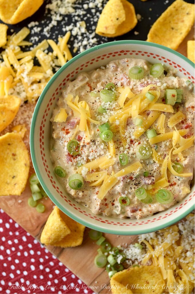 Parmesan & Cheddar Pimento Corn Chip Dip - If you're a wimp when it comes to spicy food, this flavorful Parmesan and Cheddar corn chip dip is for you. It's creamy, cheesy, absolutely packed with diced pimento, and full of flavor, without the heat found in most traditional corn chip dips. Paired with crunchy corn chips, it's the ultimate party starter, game day snack, or stay-at-home movie-night treat. And, if you’re the type of person who likes to live dangerously and crank up the heat, go right on ahead and fold in a finely chopped jalapeño. Don't be afraid to play around with the ingredients in this recipe and make it your own.