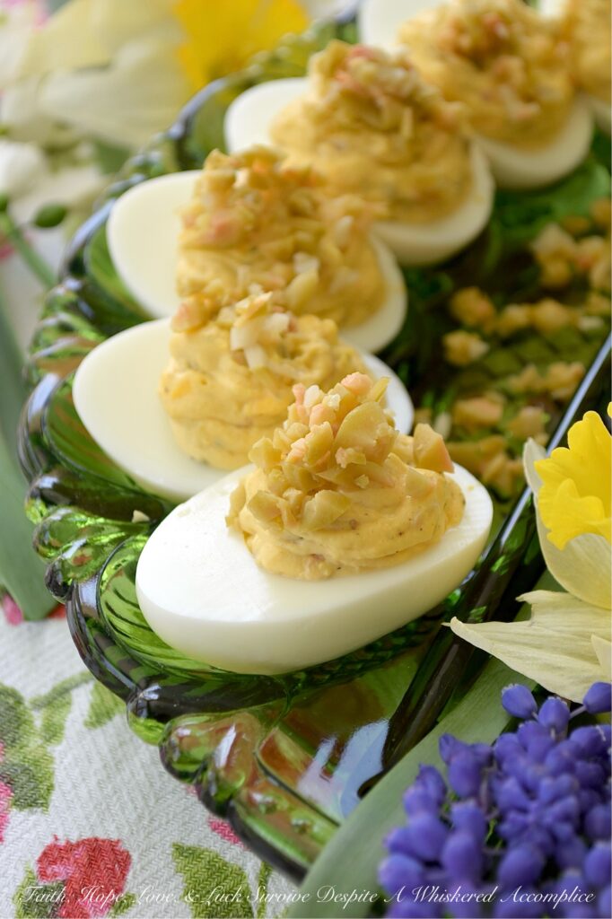 Chunky Garlic Stuffed Olive Deviled Eggs - There is a fine line between a good deviled egg and a truly great one, and that line is usually found in the garnish. What if one simple swap could make this appetizer the star of the show? The secret lies in the salty, briny pop of green olives, but with a slightly sophisticated twist. By using garlic-stuffed olives instead of the standard pimento-stuffed variety, you infuse every creamy bite with a delicate garlic punch that perfectly complements the chunky texture of these flavorful deviled eggs. It’s a small change that delivers a massive reward.