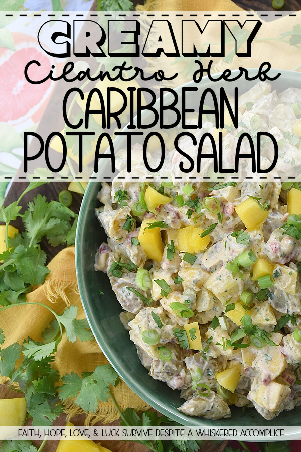 Creamy Cilantro Herb Caribbean Potato Salad - Tired of the same boring traditional potato salad? Bring a little tropical flavor to your next picnic or barbecue with this creamy Caribbean version, featuring jerk seasoning, diced pimentos, and fresh mango. This flavorful herby potato salad has a touch of heat and is just a little bit sweet. With cilantro, scallions, and a splash of vinegar to brighten things up, this island-inspired recipe turns a bag of small yellow potatoes into a side dish that will have everyone practically begging you for the recipe.