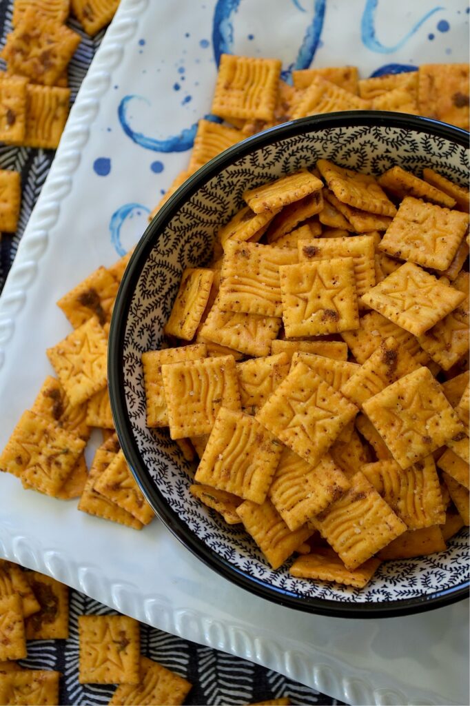 Sweet & Spicy Jerk Seasoned Cheez-It Crackers - Let’s be honest, placing a box of crackers in a bowl is the ultimate, "I tried, but not really." party move. But with a handful of spices and a little bit of time in the oven, you can transform that same box of crackers from an emergency snack into a dangerously addictive nibble. These Sweet & Spicy Jerk Seasoned Cheez-it Crackers have a bold Caribbean-inspired crunch that hits every flavor note: savory, cheesy, spicy, and perfectly sweet. Fair warning, once you put out the bowl, it’s going to disappear fast.
