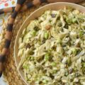 Coleslaw with Lemon Caper Remoulade - This green cabbage coleslaw is everything a summer salad should be. Crisp, refreshing, and unapologetically bold. Featuring a citrusy remoulade sauce with just enough heat to keep things interesting, this slaw hits every note. With the perfect balance of briney capers, sweet golden raisins, and roasted, salted pepitas, this isn't just a side dish; it's the star of the table.