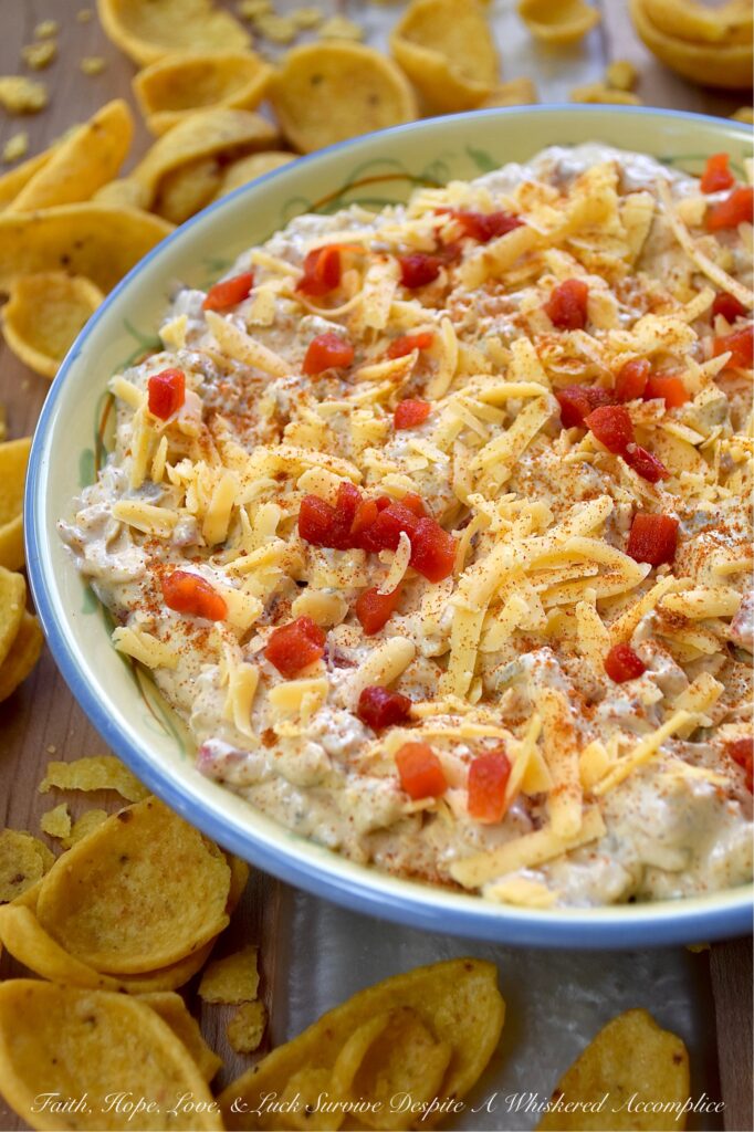 Mexican Green Chile Pimento Cheese Dip - What do you get when you take a classic southern staple and give it a south-of-the-border twist? This Mexican Green Chile Pimento Cheese Dip. With a combination of tangy cream cheese, rich mayonnaise, Mexican spices, freshly grated cheddar, pimentos, and a can of chopped green chiles, how can you possibly resist? Creamy, spicy, and packed with freshly grated cheddar cheese, this is one flavor-packed dip recipe you’ll want to have on repeat.