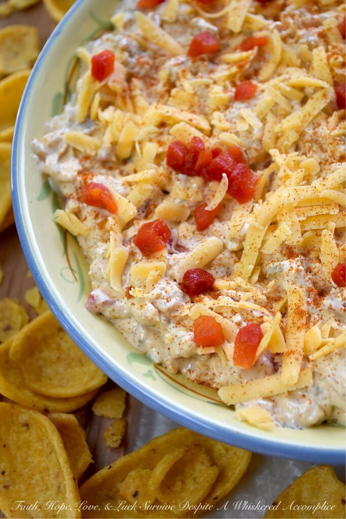 Mexican Green Chile Pimento Cheese Dip - What do you get when you take a classic southern staple and give it a south-of-the-border twist? This Mexican Green Chile Pimento Cheese Dip. With a combination of tangy cream cheese, rich mayonnaise, Mexican spices, freshly grated cheddar, pimentos, and a can of chopped green chiles, how can you possibly resist? Creamy, spicy, and packed with freshly grated cheddar cheese, this is one flavor-packed dip recipe you’ll want to have on repeat.