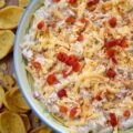 Mexican Green Chile Pimento Cheese Dip - What do you get when you take a classic southern staple and give it a south-of-the-border twist? This Mexican Green Chile Pimento Cheese Dip. With a combination of tangy cream cheese, rich mayonnaise, Mexican spices, freshly grated cheddar, pimentos, and a can of chopped green chiles, how can you possibly resist? Creamy, spicy, and packed with freshly grated cheddar cheese, this is one flavor-packed dip recipe you’ll want to have on repeat.