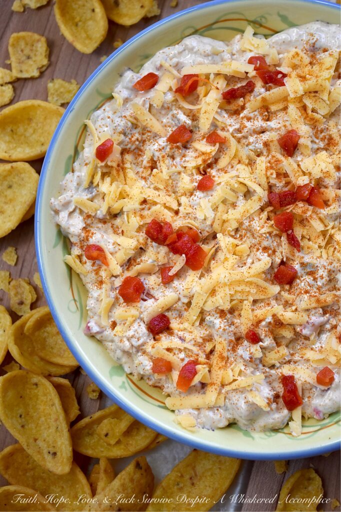 Mexican Green Chile Pimento Cheese Dip - What do you get when you take a classic southern staple and give it a south-of-the-border twist? This Mexican Green Chile Pimento Cheese Dip. With a combination of tangy cream cheese, rich mayonnaise, Mexican spices, freshly grated cheddar, pimentos, and a can of chopped green chiles, how can you possibly resist? Creamy, spicy, and packed with freshly grated cheddar cheese, this is one flavor-packed dip recipe you’ll want to have on repeat.