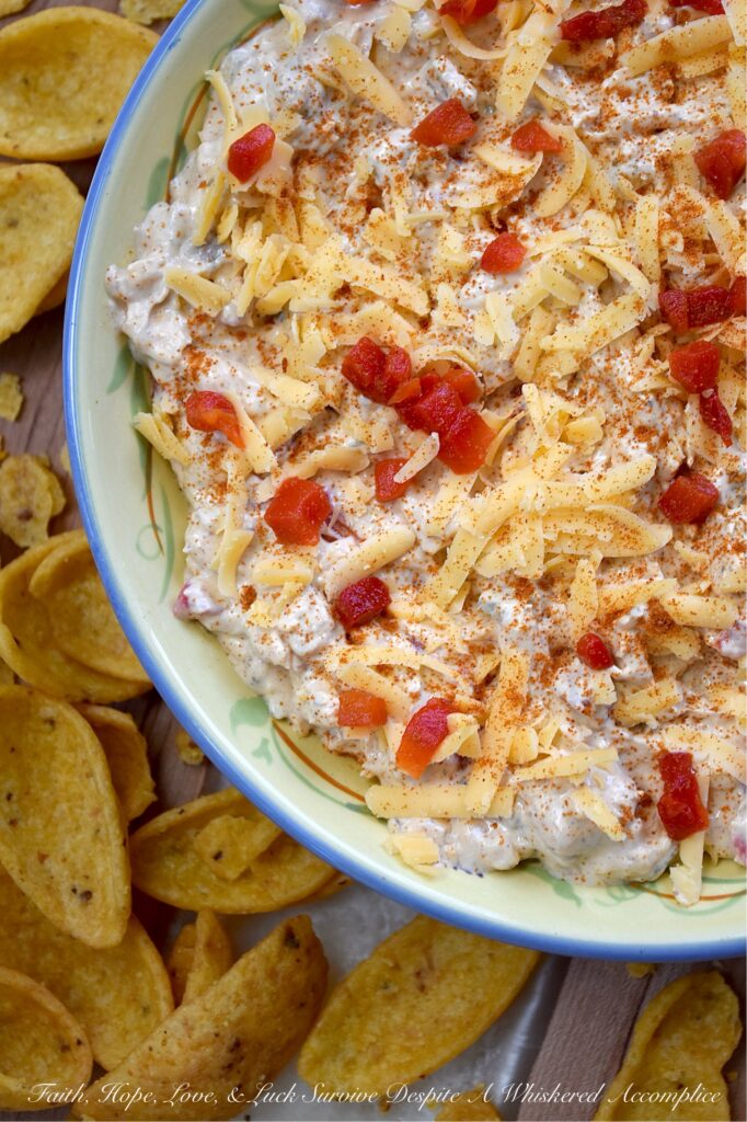 Mexican Green Chile Pimento Cheese Dip - What do you get when you take a classic southern staple and give it a south-of-the-border twist? This Mexican Green Chile Pimento Cheese Dip. With a combination of tangy cream cheese, rich mayonnaise, Mexican spices, freshly grated cheddar, pimentos, and a can of chopped green chiles, how can you possibly resist? Creamy, spicy, and packed with freshly grated cheddar cheese, this is one flavor-packed dip recipe you’ll want to have on repeat.