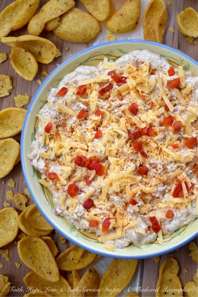 Mexican Green Chile Pimento Cheese Dip - What do you get when you take a classic southern staple and give it a south-of-the-border twist? This Mexican Green Chile Pimento Cheese Dip. With a combination of tangy cream cheese, rich mayonnaise, Mexican spices, freshly grated cheddar, pimentos, and a can of chopped green chiles, how can you possibly resist? Creamy, spicy, and packed with freshly grated cheddar cheese, this is one flavor-packed dip recipe you’ll want to have on repeat.